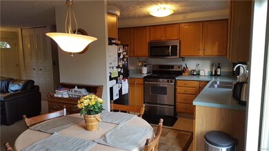 Newer stainless steel gas range, microwave, fridge