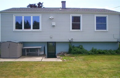 this is the fully- fenced backyard with storage sh