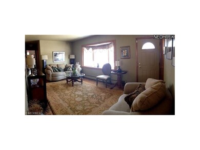 Formal living Room with bay window and hardwood fl