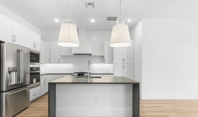 Kitchen with full-height subway tile backsplash