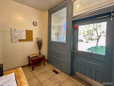 Entryway with tile patterned flooring
