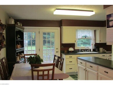 French doors lead to a deck and patio with retract