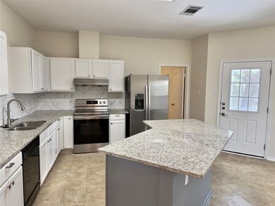 Kitchen featuring stainless steel appliances, dec