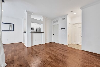 Living room with hard wood floors and high celling