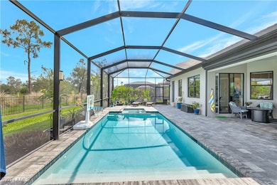 View of pool with a patio area, a pool with connec