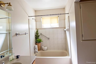 Bathroom with vanity and shower / bathtub combination