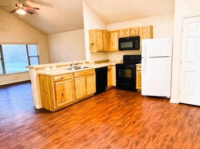 Kitchen with a peninsula, vaulted ceiling, black 