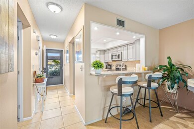View toward completely updated kitchen and breakfast bar