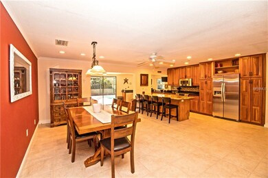 Large family room off of the kitchen is currently being used as a dining room.