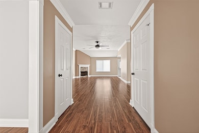 Bright and welcoming entry with wood-look flooring throughout.