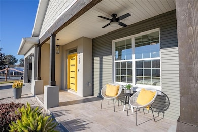 Covered front porch with fan and custom wood columns