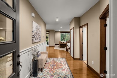 An extra wide foyer provides room for warm hellos and long goodbyes. The 3 doors on right side of photo: 1st door is the office, middle door is the bathroom, closed door is a large L-shaped closet.