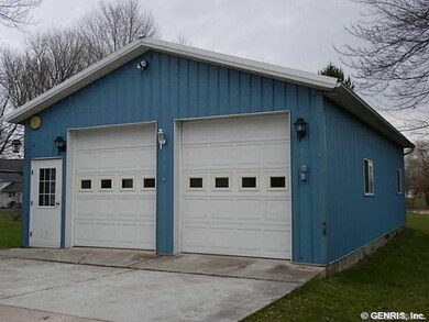 Garage. HIGH OVERHEAD DOORS