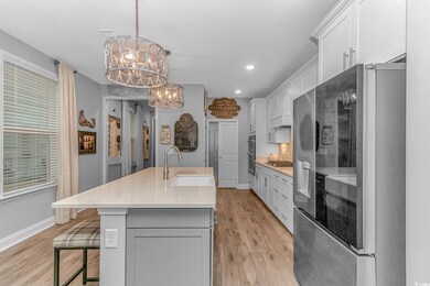 Kitchen featuring stainless steel appliances, sink