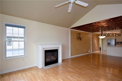 The open floor plan unites the cathedral living ro
