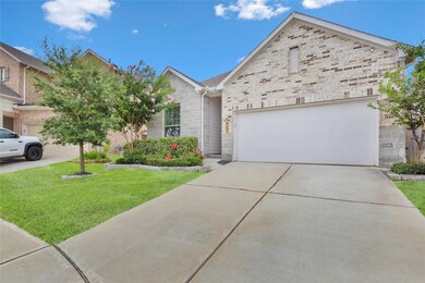 The property includes a two-car garage with a spac