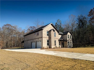 View of front of house with driveway, a front yard
