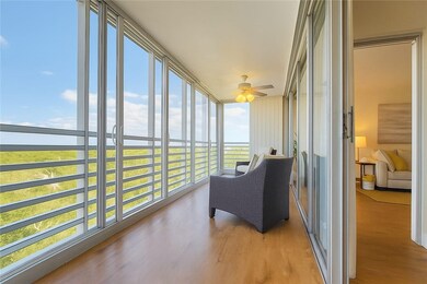 Sunroom / solarium with wood finished floors and floor to ceiling windows