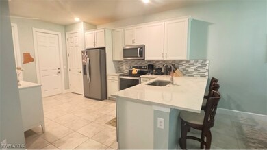 Kitchen with appliances with stainless steel finis
