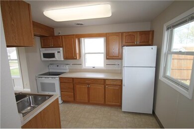 Kitchen. New stove, refrigerator, and tile backspl