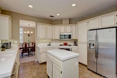 The kitchen offers a center island, and stainless 