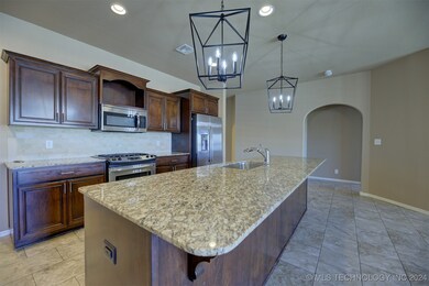 Kitchen with new light fixtures,granite counters.
