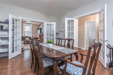 The formal dining room that has beautiful french d