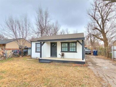 View of front of property with covered porch and a