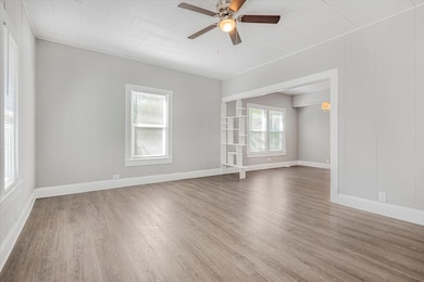 Empty room featuring wood-type flooring and ceilin