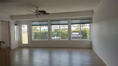 Florida Room with access to laundry room and paved patio.