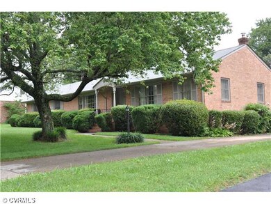 Exterior Front - A beautiful tree shades the paved
