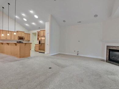Open floor plan with high ceilings, gas fireplace 