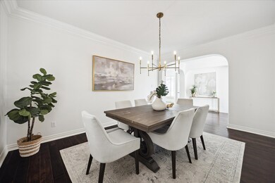 The formal dining room is defined by crisp white w