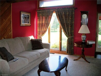 Small foyer leads to the living room, with overloo