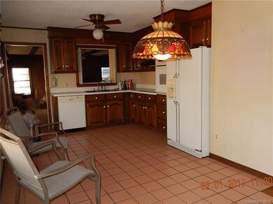 Kitchen has passthrough window to sunken den