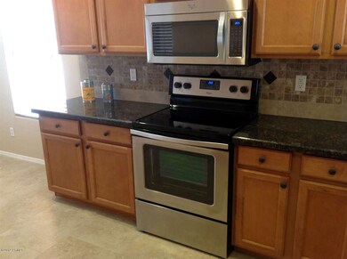 kitchen with new stove and microwave
