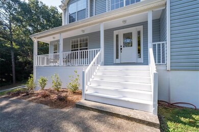 Property entrance with covered porch