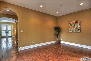 Formal Dining Room with Living Room and Foyer to l