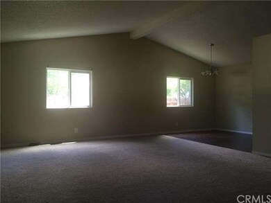 Living room looking into dining area off kitchen