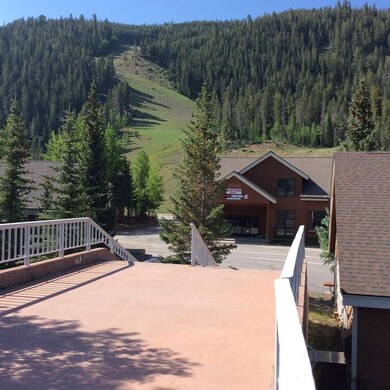 Walk over the Snake River to ski lifts and ticket