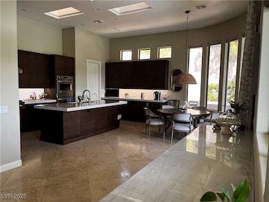 Kitchen with light countertops, plenty of natural