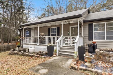 View of front of property featuring a porch and ro
