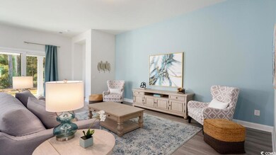 Living area featuring wood finished floors and baseboards