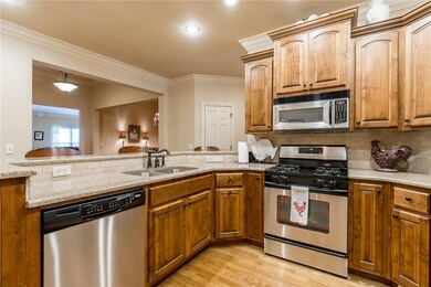 Kitchen opens to the dining and living areas.