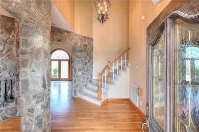 Entrance foyer featuring stairway, a high ceiling,