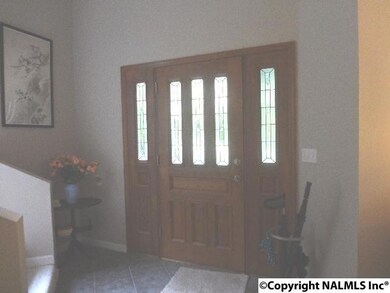 Solid wood entry door with side lights.