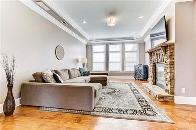 Big Family Room with stone stacked see-thru firepl