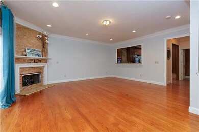 Unfurnished living room with crown molding, a prem