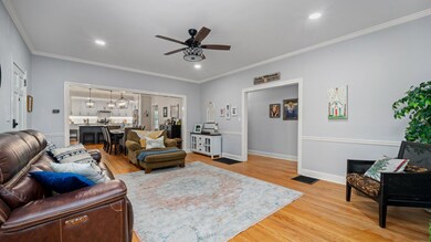 Living room open to dining and kitchen