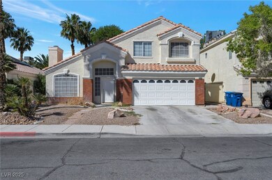 Mediterranean / spanish home with a tile roof, concrete driveway, an attached garage, and a chimney